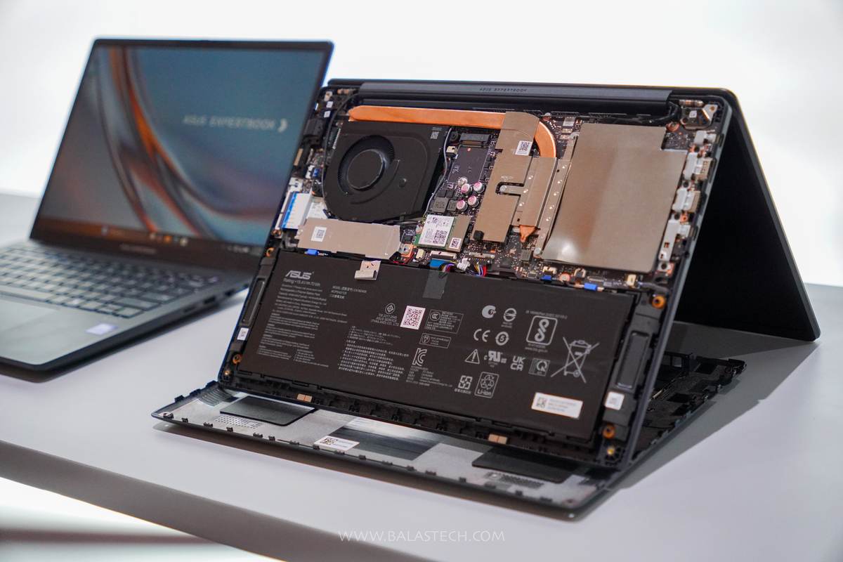 ASUS ExpertBook Ultra internals showing the 70Wh battery and dual fan cooling